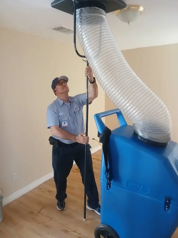 Furnace Tune-Up technician using HEPA equipment in Valrico